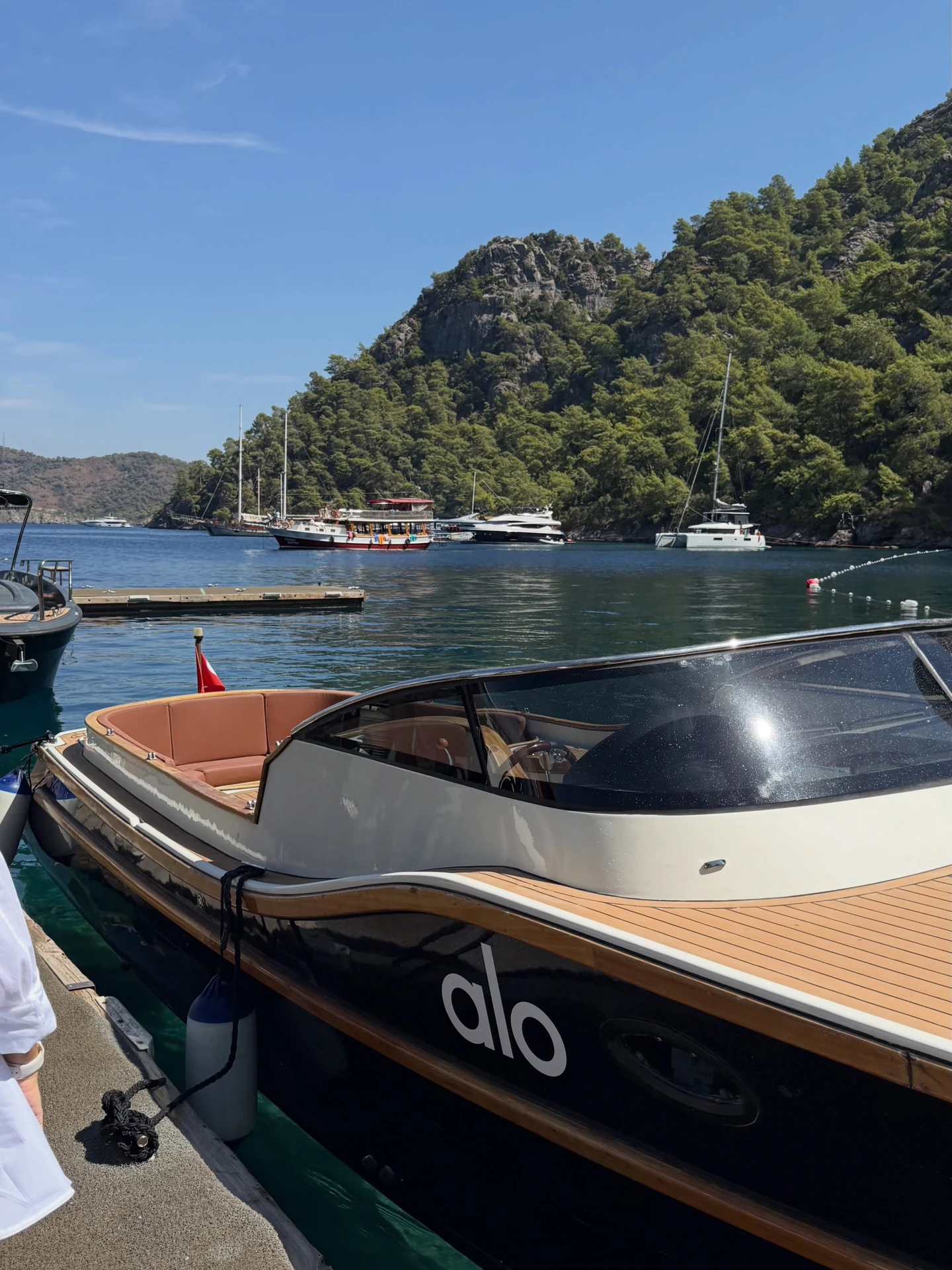 An Alo-branded boat on the water at Yazz Collective