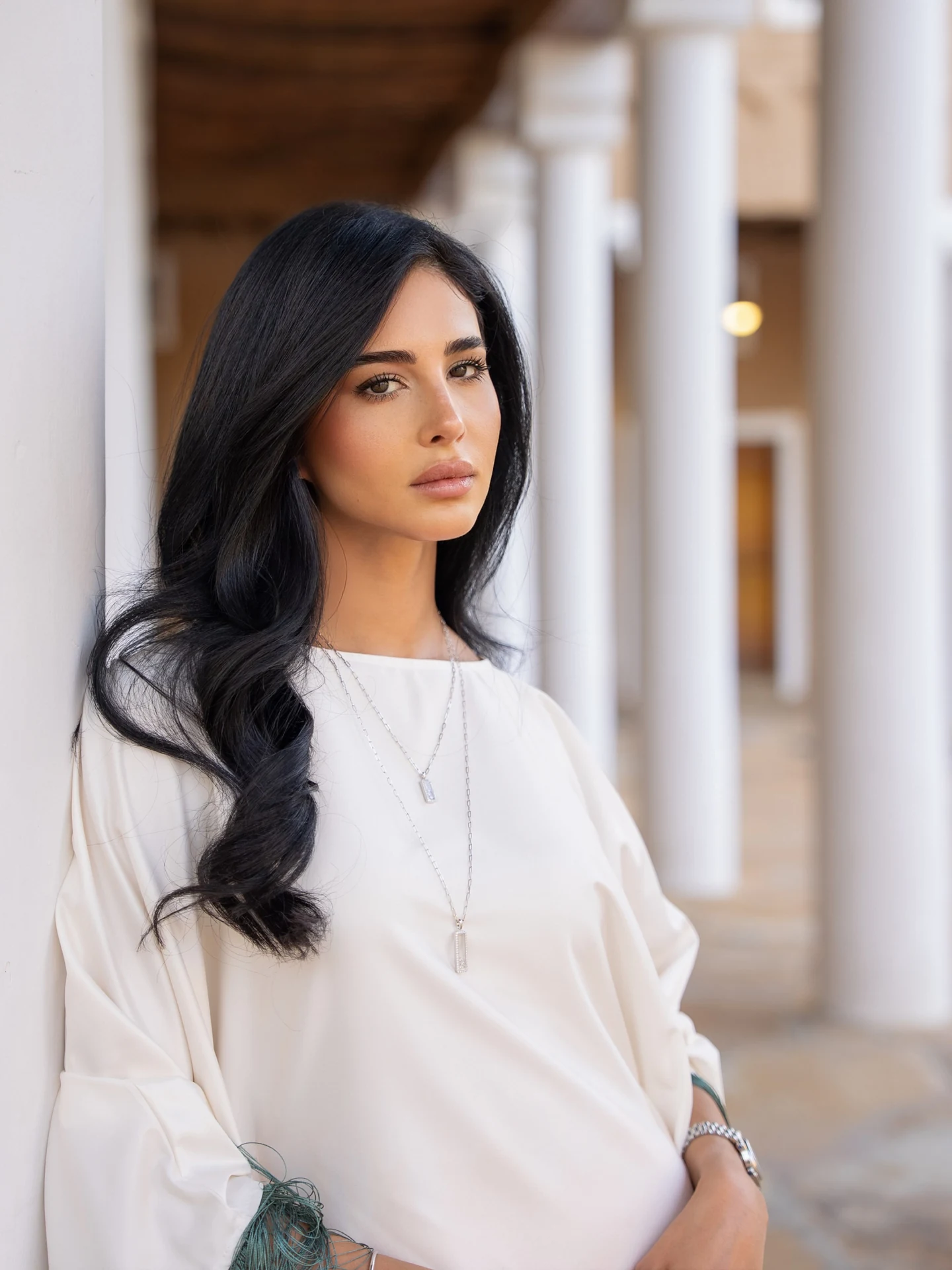 Rahaf Alharbi in a white and green outfit wearing Chopard jewelry