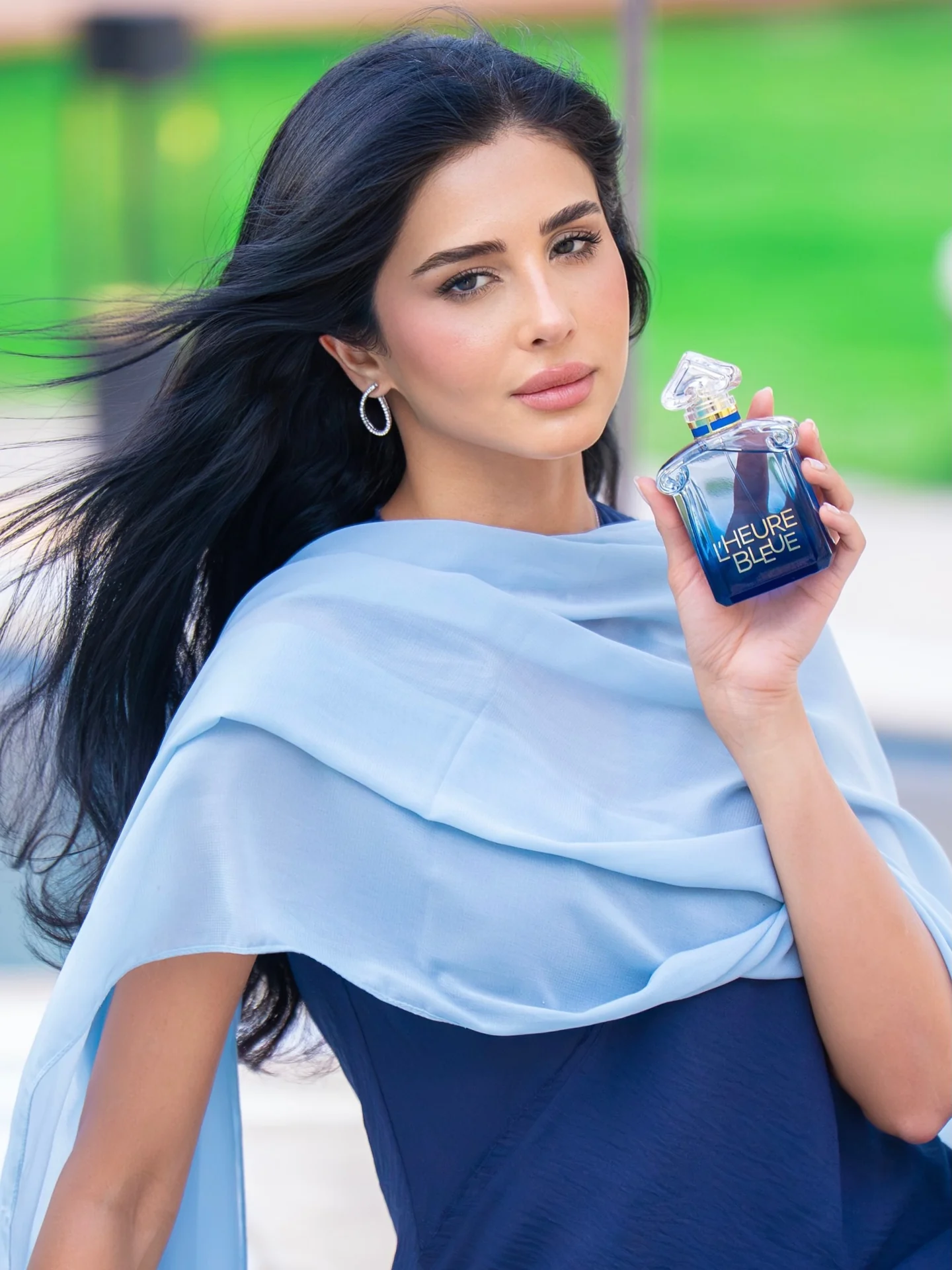 Rahaf holding Guerlain L’Heure Bleue outdoors