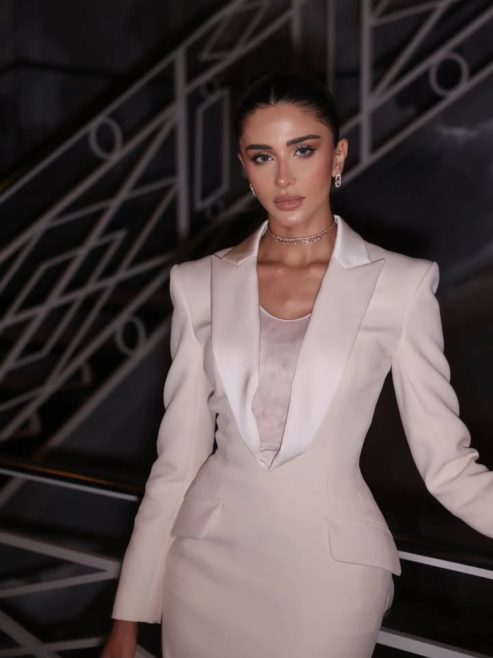 Portrait of Rahaf Alharbi in an ivory gown and Messika diamond jewelry