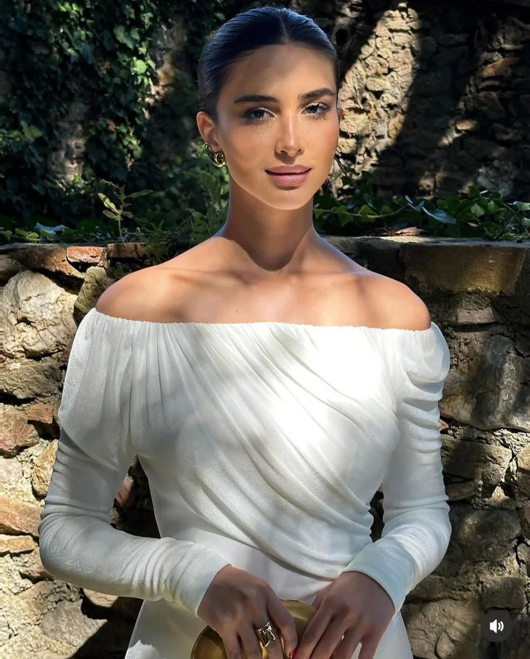 Rahaf Alharbi in a garden wearing a white dress