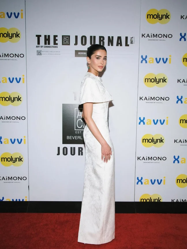 White gown at The Journal gala backdrop