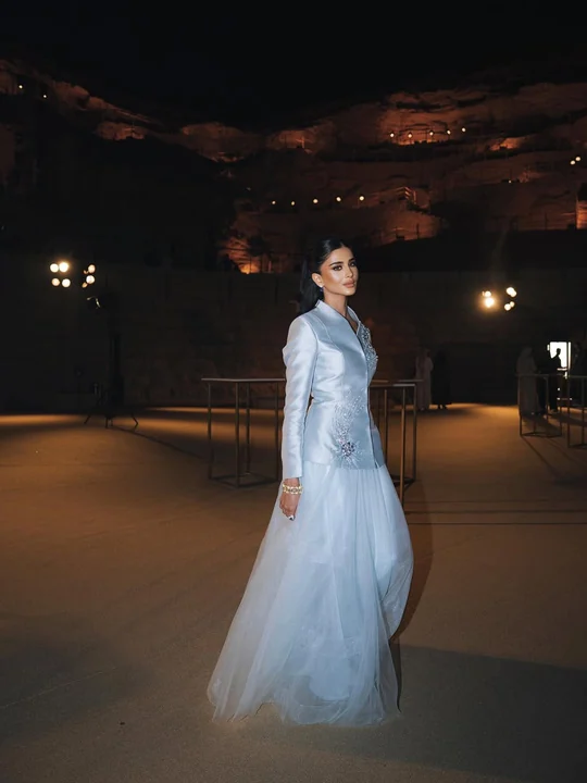 Rahaf photographed outdoors at night during Riyadh Fashion Week