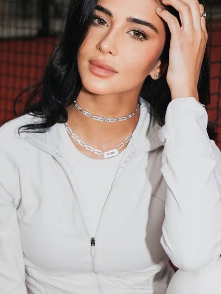 Layered diamond necklaces with white shirt