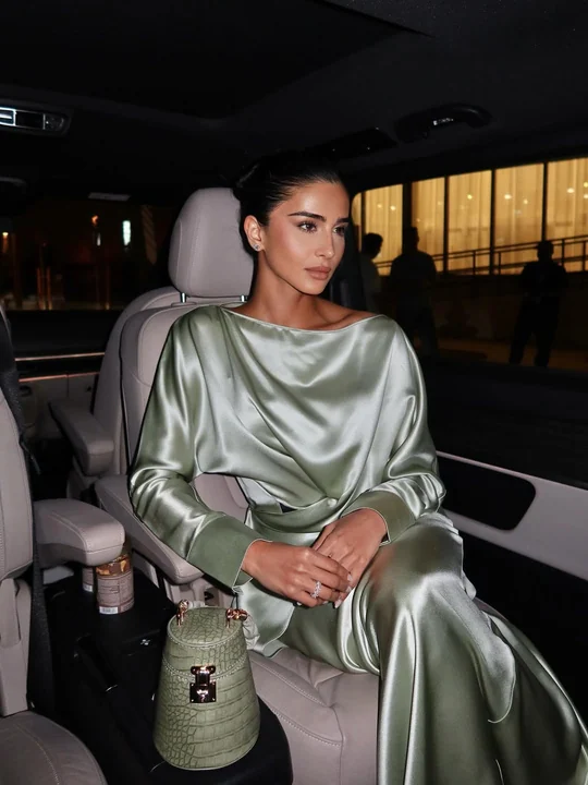 Rahaf in silver seated inside Mercedes
