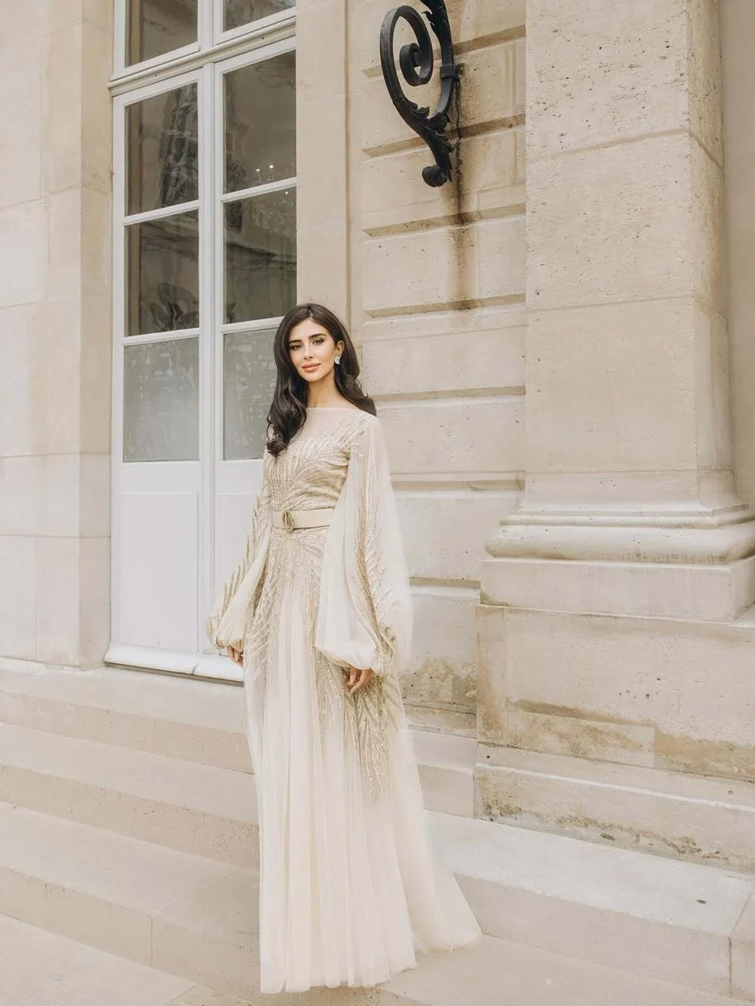 Rahaf outside a Paris building in her embroidered look