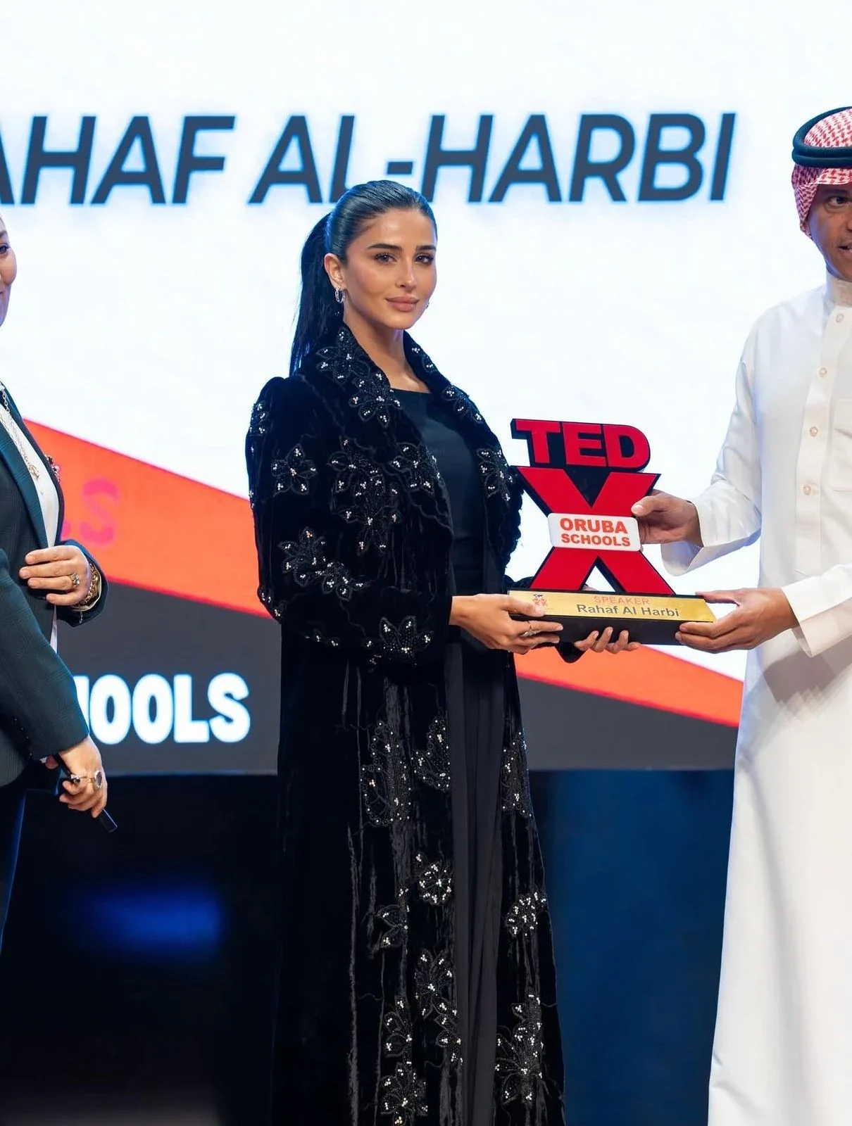 Rahaf receiving a TEDx Oruba Schools speaker trophy