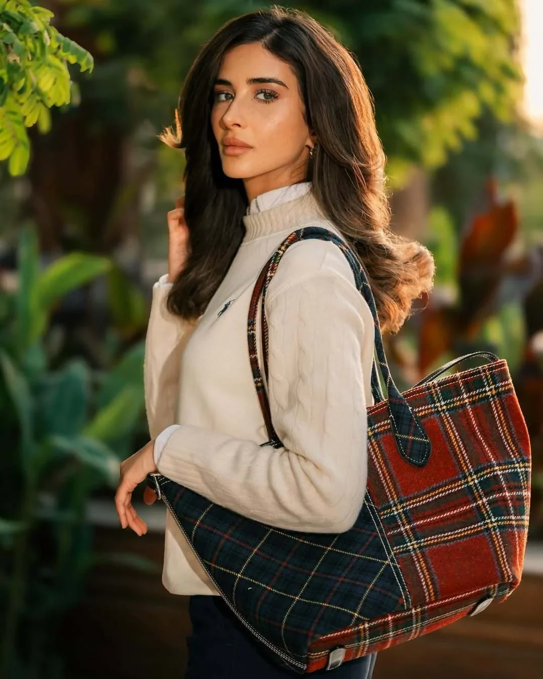 Rahaf carrying a checked Polo Ralph Lauren tote over her shoulder