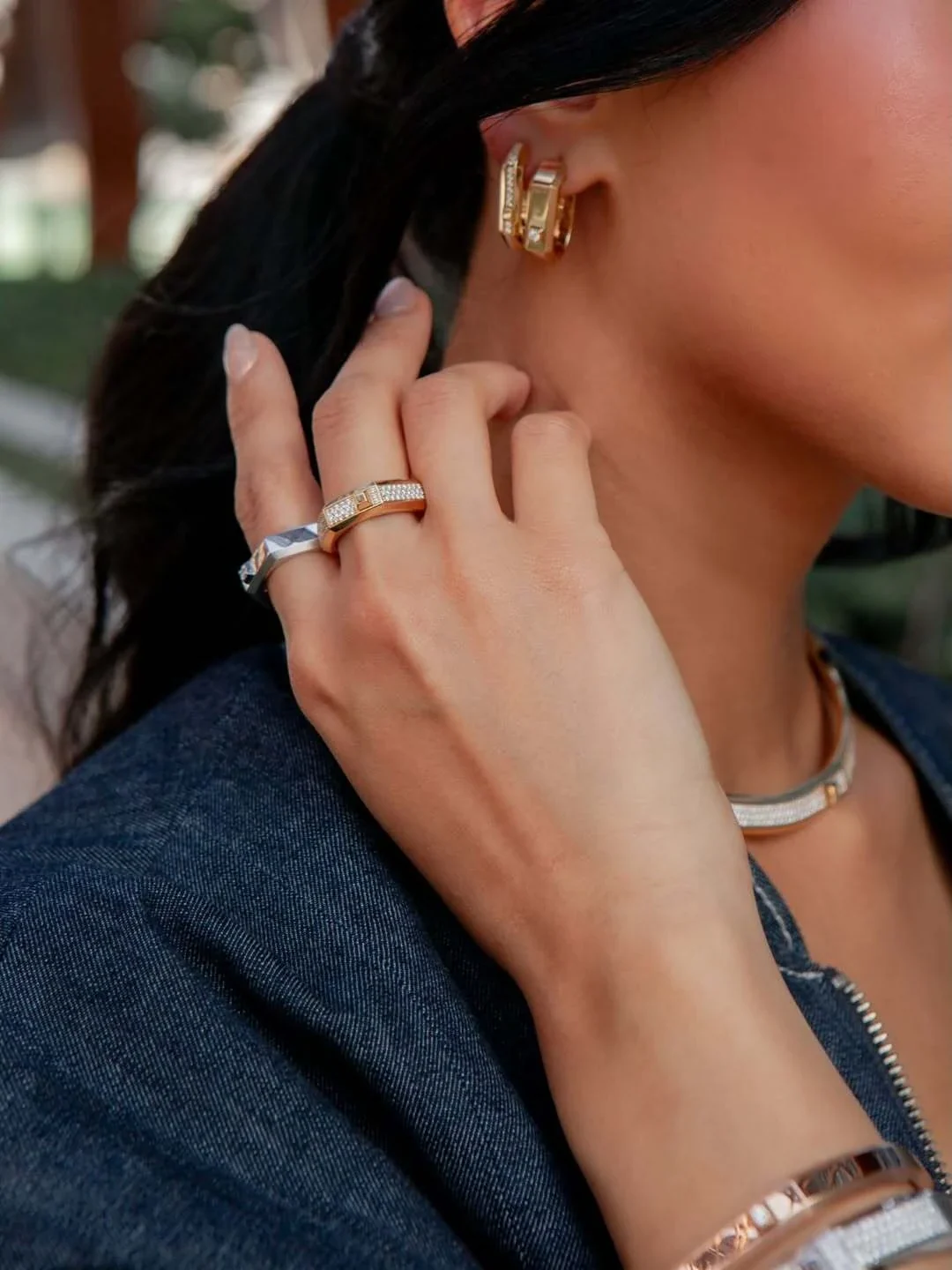 Dark-blue shirt hand and necklace detail