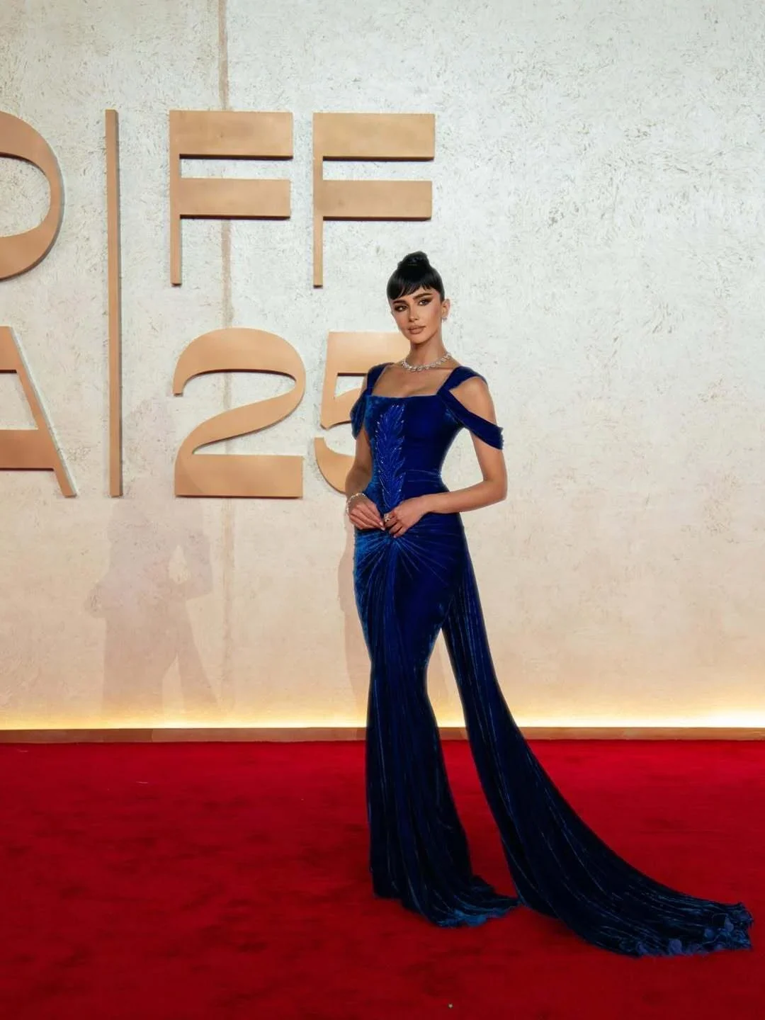 Rahaf in a blue gown at the Red Sea Film Festival