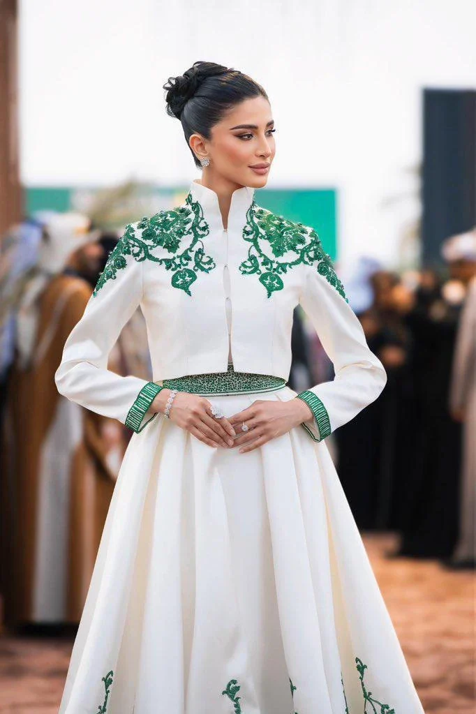 Rahaf in a white and green embroidered look at the Saudi Cup