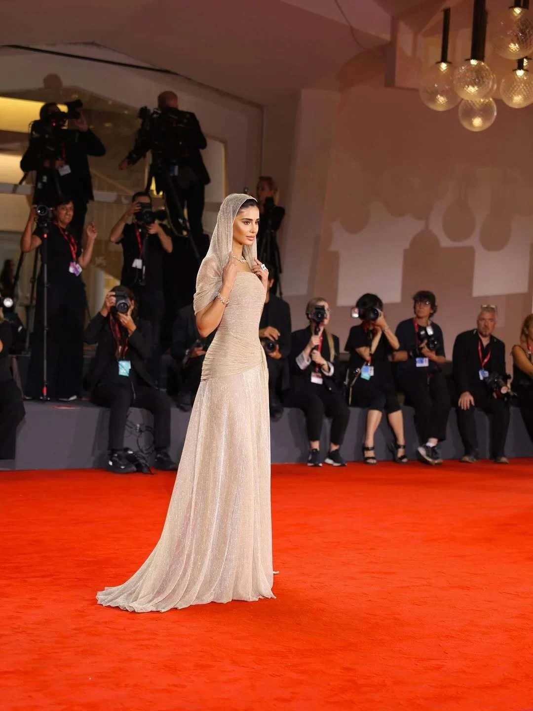 Rahaf on the Venice Film Festival red carpet in a pale gown